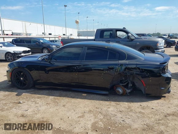 2019 Dodge Charger R/T with VIN 2C3CDXCT2KH575297, listed as a IAAI auction lot 41661339 with 119,854 mi miles and . Bid and sale history available at DreamBid. Image 14.