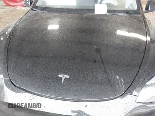 2023 Tesla Model Y Performance with VIN 7SAYGDEF2PF800641, listed as a IAAI auction lot 41612596 with 60,984 mi miles and . Bid and sale history available at DreamBid. Image 10.