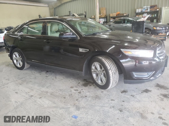 2014 Ford Taurus SEL z VIN 1FAHP2E80EG128686, wystawiony jako Copart lot #57158255 z przebiegiem 69 529 mil mil oraz Szkoda całkowita • Salvage title. Historia ofert i sprzedaży dostępna na DreamBid. Obrazek 4.