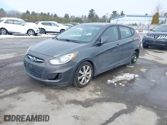 2012 Hyundai Accent SE with VIN KMHCU5AE4CU037411, listed as a IAAI auction lot 41659662 with 163,021 mi miles. Bid and sale history available at carsss.com. Image 2.