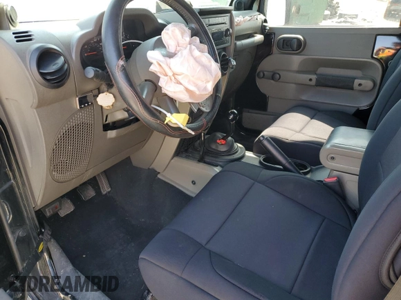 2009 Jeep Wrangler X with VIN 1J4FA24139L730383, listed as a Copart auction lot 51914935 with 168,265 mi miles and Salvage Title. Bid and sale history available at DreamBid. Image 7.