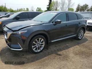 2019 Mazda CX-9 Grand Touring z VIN JM3TCBDY9K0330035, wystawiony jako Copart lot #59019315 z przebiegiem 148 076 mil mil oraz Czysty tytuł • Clean title. Historia ofert i sprzedaży dostępna na DreamBid. Obrazek 1.