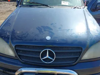 2000 Mercedes-Benz M-Class with VIN 4JGAB54E8YA148786, listed as a IAAI auction lot 41831892 with 999,999 mi miles. Bid and sale history available at carsss.com. Image 10.