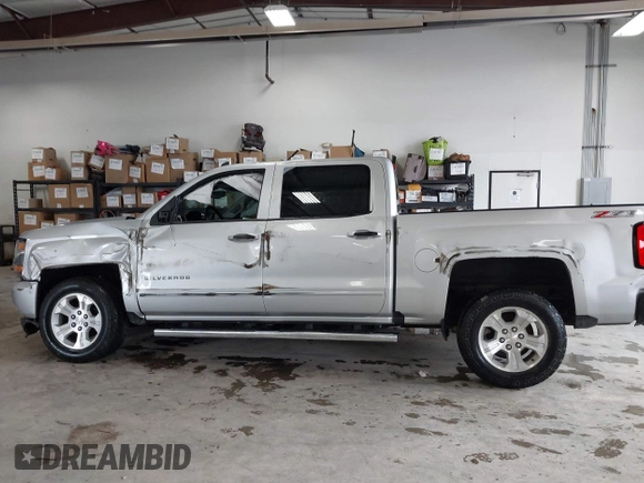 2017 Chevrolet Silverado 1500 LT with VIN 3GCUKREC2HG473554, listed as a IAAI auction lot 42220143 with 80,000 mi miles and . Bid and sale history available at DreamBid. Image 14.