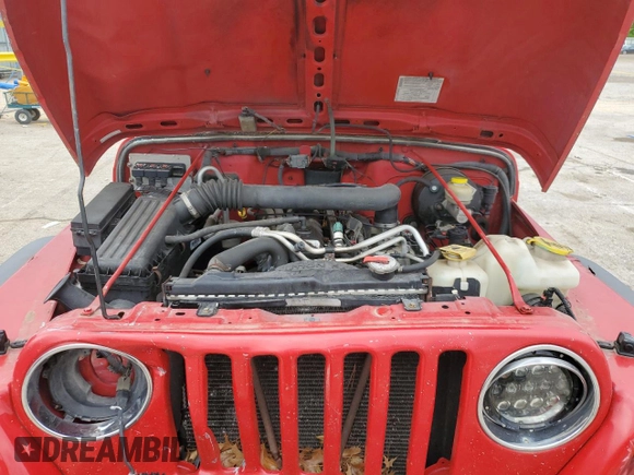 2005 Jeep Wrangler Sport z VIN 1J4FA49S75P317995, wystawiony jako Copart lot #58060055 z przebiegiem 189 332 mil mil oraz Szkoda całkowita • Salvage title. Historia ofert i sprzedaży dostępna na DreamBid. Obrazek 11.