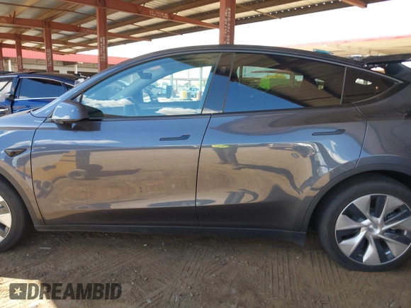 2023 Tesla Model Y Long Range with VIN 7SAYGDEE4PF875915, listed as a IAAI auction lot 42095178 with 11,928 mi miles and . Bid and sale history available at DreamBid. Image 14.