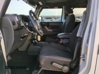 2018 Jeep Wrangler JK Unlimited Sport S with VIN 1C4BJWDG6JL890665, listed as a Copart auction lot 83833854 with 23,390 mi miles and Salvage Title. Bid and sale history available at carsss.com. Image 7.