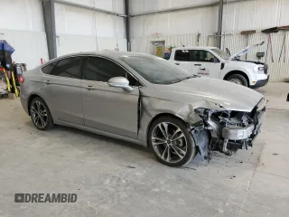 2020 Ford Fusion Titanium с VIN 3FA6P0K90LR112034, выставлен на аукционе Copart как лот 56740025 с пробегом 89 117 миль миль и Списание • Salvage title. История ставок и продаж доступна на DreamBid. Изображение 4.