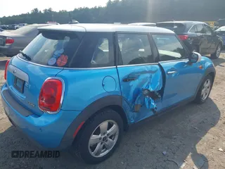 2015 MINI Hardtop 4 Door z VIN WMWXS5C51FT829693, wystawiony jako IAAI lot #42497639 z przebiegiem 36 494 mil mil oraz . Historia ofert i sprzedaży dostępna na DreamBid. Obrazek 4.