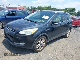 2015 Ford Escape Titanium with VIN 1FMCU9J96FUC01790, listed as a IAAI auction lot 42844336 with 133,005 mi miles and . Bid and sale history available at DreamBid. Image 2.