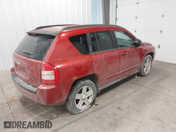 2010 Jeep Compass Sport with VIN 1J4NF4FB2AD506051, listed as a IAAI auction lot 41552084 with 218,785 mi miles. Bid and sale history available at carsss.com. Image 4.