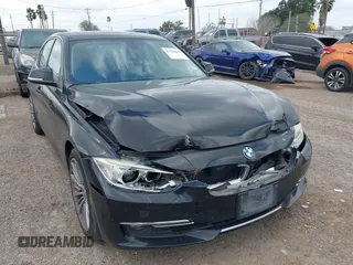 2013 BMW 3 Series 328i with VIN WBA3A5C58DF352998, listed as a IAAI auction lot 41516042 with 205,977 mi miles. Bid and sale history available at carsss.com. Image 1.