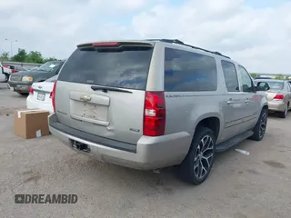 2009 Chevrolet Suburban LT w/2LT with VIN 1GNFC26039R234735, listed as a IAAI auction lot 42068617 with 263,534 mi miles. Bid and sale history available at carsss.com. Image 4.