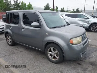 2010 Nissan Cube S z VIN JN8AZ2KR9AT153627, wystawiony jako IAAI lot #42352451 z przebiegiem 184 305 mil mil oraz . Historia ofert i sprzedaży dostępna na DreamBid. Obrazek 1.