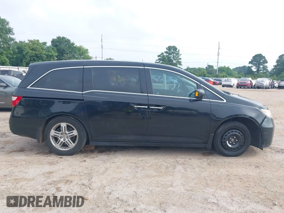 2011 Honda Odyssey Touring with VIN 5FNRL5H90BB070472, listed as a IAAI auction lot 42367710 with 203,589 mi miles and . Bid and sale history available at DreamBid. Image 13.