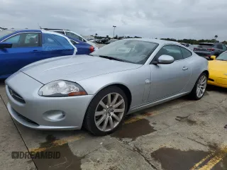 2007 Jaguar XK with VIN SAJWA43B475B12815, listed as a Copart auction lot 75012064 with 55,917 mi miles and Salvage Title. Bid and sale history available at carsss.com. Image 1.