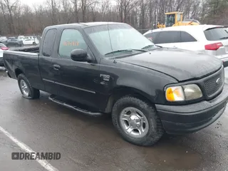 2002 Ford F-150 XL with VIN 1FTRX17W92NA80214, listed as a IAAI auction lot 41074951 with 164,048 mi miles. Bid and sale history available at carsss.com. Image 1.
