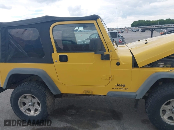 2005 Jeep Wrangler SE z VIN 1J4FA29S95P373313, wystawiony jako IAAI lot #42340611 z przebiegiem 162 801 mil mil oraz . Historia ofert i sprzedaży dostępna na DreamBid. Obrazek 13.
