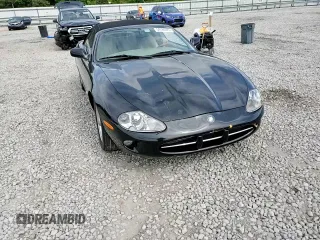1999 Jaguar XK z VIN SAJGX2044XC031383, wystawiony jako Copart lot #54726925 z przebiegiem 107 696 mil mil oraz Szkody całkowita. Historia ofert i sprzedaży dostępna na DreamBid. Obrazek 13.