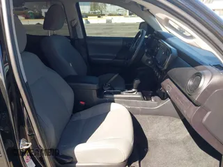 2018 Toyota Tacoma SR with VIN 3TMCZ5AN2JM127244, listed as a IAAI auction lot 41698199 with 61,535 mi miles and . Bid and sale history available at DreamBid. Image 5.