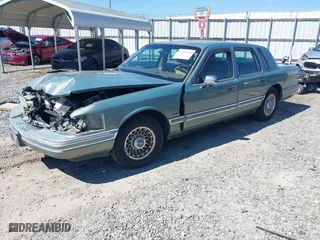 1994 Lincoln Town Car Signature with VIN 1LNLM82W5RY616904, listed as a IAAI auction lot 41811628 with 163,653 mi miles. Bid and sale history available at carsss.com. Image 17.