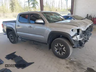 2018 Toyota Tacoma SR with VIN 3TMCZ5ANXJM146284, listed as a IAAI auction lot 42041525 with 103,143 mi miles and . Bid and sale history available at DreamBid. Image 1.
