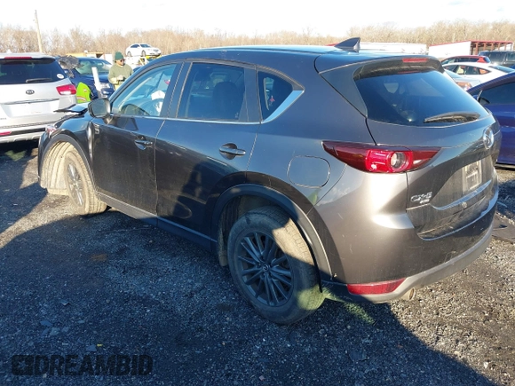 2021 Mazda CX-5 Touring with VIN JM3KFBCM8M1370640, listed as a IAAI auction lot 41207736 with 57,570 mi miles. Bid and sale history available at carsss.com. Image 3.