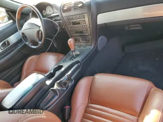 2003 Ford Thunderbird Deluxe z VIN 1FAHP60A63Y104093, wystawiony jako Copart lot #76028744 z przebiegiem 79 995 mil mil oraz Szkoda całkowita • Salvage title. Historia ofert i sprzedaży dostępna na DreamBid. Obrazek 8.