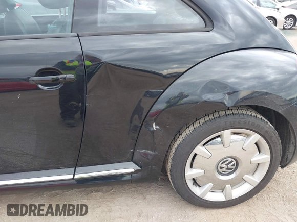 2013 Volkswagen Beetle 2.5L with VIN 3VWJP7AT8DM679548, listed as a IAAI auction lot 41459613 with 135,198 mi miles and . Bid and sale history available at DreamBid. Image 6.