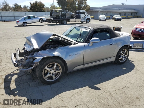 2003 Honda S2000 with VIN JHMAP11483T006461, listed as a Copart auction lot 52099995 with 187,376 mi miles and Salvage Title. Bid and sale history available at DreamBid. Image 1.
