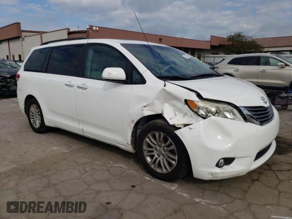 2012 Toyota Sienna XLE AAS with VIN 5TDYK3DC0CS250830, listed as a Copart auction lot 73323284 with 147,580 mi miles and Salvage Title. Bid and sale history available at DreamBid. Image 4.