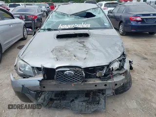 2007 Subaru Impreza WRX STI z VIN JF1GD76677L526227, wystawiony jako IAAI lot #42034710 z przebiegiem 93 767 mil mil oraz . Historia ofert i sprzedaży dostępna na DreamBid. Obrazek 12.