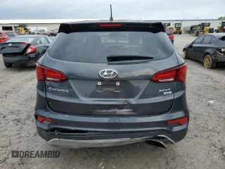 2018 Hyundai Santa Fe 2.4L z VIN 5XYZTDLB4JG553426, wystawiony jako Copart lot #54609875 z przebiegiem 93 328 mil mil oraz Szkoda całkowita • Salvage title. Historia ofert i sprzedaży dostępna na DreamBid. Obrazek 6.