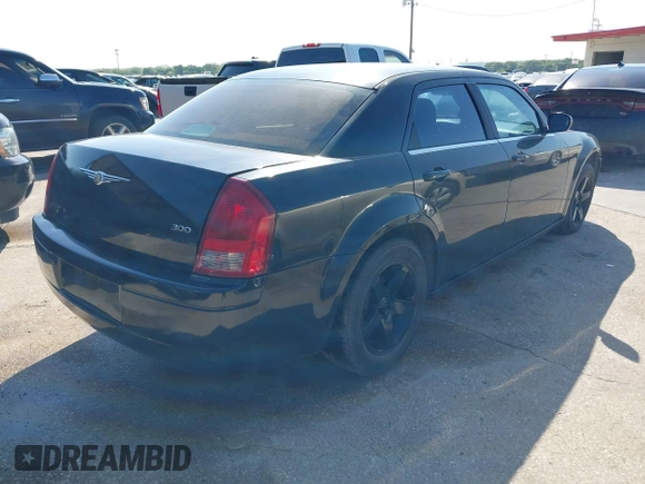 2005 Chrysler 300 with VIN 2C3JA43R65H668010, listed as a IAAI auction lot 41976405 with 216,099 mi miles. Bid and sale history available at carsss.com. Image 4.