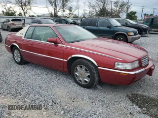 2001 Cadillac Eldorado ESC z VIN 1G6EL12Y11B103541, wystawiony jako Copart lot #45219055 z przebiegiem 46 179 mil mil oraz Tytuł czysty. Historia ofert i sprzedaży dostępna na DreamBid. Obrazek 4.