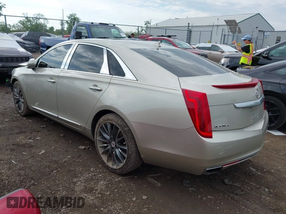 2014 Cadillac XTS Platinum z VIN 2G61T5S31E9209179, wystawiony jako IAAI lot #42241440 z przebiegiem 79 651 mil mil oraz . Historia ofert i sprzedaży dostępna na DreamBid. Obrazek 3.