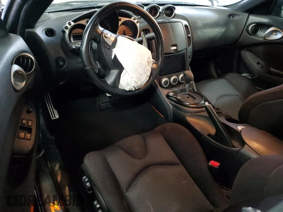 2009 Nissan 370Z z VIN JN1AZ44EX9M407193, wystawiony jako Copart lot #84891734 z przebiegiem 129 296 mil mil oraz Szkoda całkowita • Salvage title. Historia ofert i sprzedaży dostępna na DreamBid. Obrazek 8.