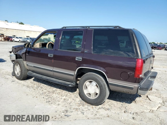1997 GMC Yukon with VIN 1GKEK13R7VJ711782, listed as a Copart auction lot 74793184 with 208,718 mi miles and Salvage Title. Bid and sale history available at carsss.com. Image 2.