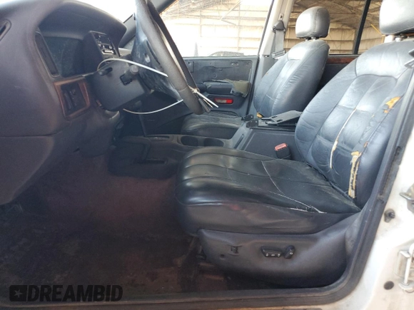 1996 Jeep Grand Cherokee with VIN 1J4EZ78Y9TC104398, listed as a Copart auction lot 69706254 with Not provided miles and Salvage title. Bid and sale history available at DreamBid. Image 7.