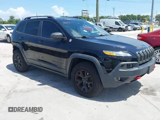 2017 Jeep Cherokee Trailhawk z VIN 1C4PJMBS9HW537962, wystawiony jako IAAI lot #42002460 z przebiegiem 129 037 mil mil oraz . Historia ofert i sprzedaży dostępna na DreamBid. Obrazek 1.