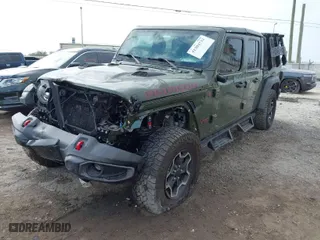 2021 Jeep Gladiator Rubicon with VIN 1C6JJTBG6ML619775, listed as a IAAI auction lot 41304732 with 37,731 mi miles. Bid and sale history available at carsss.com. Image 2.