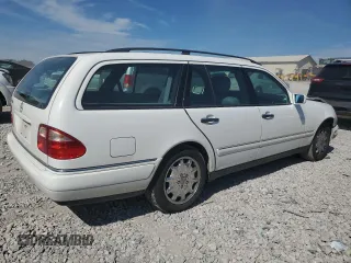 1999 Mercedes-Benz E-Class with VIN WDBJH65F1XA811693, listed as a Copart auction lot 69370604 with 128,876 mi miles and Salvage Title. Bid and sale history available at carsss.com. Image 3.