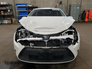 2021 Toyota Corolla Hybrid LE with VIN JTDEAMDE4MJ002382, listed as a Copart auction lot 50318865 with 74,385 mi miles and Salvage Title. Bid and sale history available at carsss.com. Image 5.