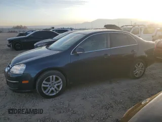 2007 Volkswagen Jetta z VIN 3VWDG71K27M010409, wystawiony jako Copart lot #84155424 z przebiegiem 140 665 mil mil oraz Czysty tytuł • Clean title. Historia ofert i sprzedaży dostępna na DreamBid. Obrazek 1.
