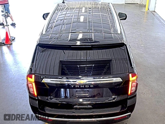2022 Chevrolet Tahoe LS z VIN 1GNSKMKD7NR129745, wystawiony jako IAAI lot #42566236 z przebiegiem 95 126 mil mil oraz . Historia ofert i sprzedaży dostępna na DreamBid. Obrazek 17.