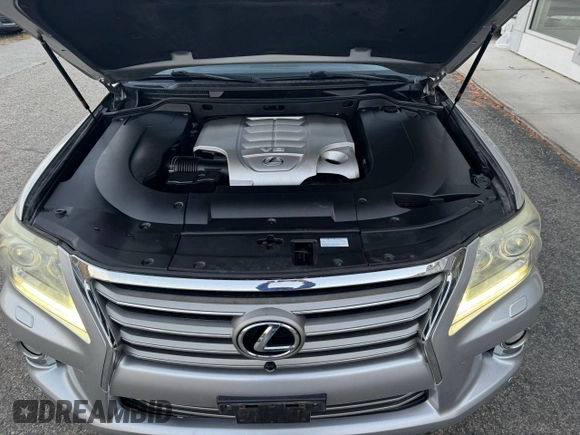 2013 Lexus LX 570 z VIN JTJHY7AX8D4089490, wystawiony jako Copart lot #76832954 z przebiegiem 203 267 mil mil oraz Czysty tytuł • Clean title. Historia ofert i sprzedaży dostępna na DreamBid. Obrazek 7.