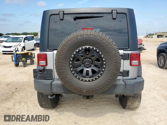 2015 Jeep Wrangler Unlimited Rubicon z VIN 1C4BJWFG0FL529310, wystawiony jako Copart lot #64337405 z przebiegiem Nie podano mil oraz Szkoda całkowita • Salvage title. Historia ofert i sprzedaży dostępna na DreamBid. Obrazek 6.