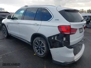 2018 BMW X5 xDrive40e iPerformance with VIN 5UXKT0C58J0V99415, listed as a IAAI auction lot 41391474 with 124,671 mi miles. Bid and sale history available at carsss.com. Image 3.