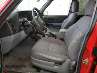 1998 Jeep Cherokee Sport with VIN 1J4FJ68S7WL148034, listed as a Copart auction lot 52436475 with 80,239 mi miles and Salvage Title. Bid and sale history available at carsss.com. Image 7.