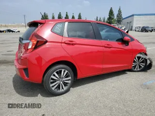 2015 Honda Fit EX-L with VIN 3HGGK5H87FM701108, listed as a Copart auction lot 55536945 with 57,519 mi miles and Salvage title. Bid and sale history available at DreamBid. Image 3.